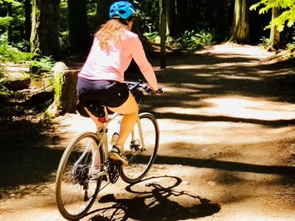 BWSS Sweat to Support Survivors participant Melanie biking