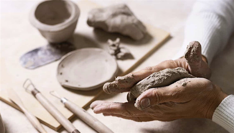 Woman's hands making pottery