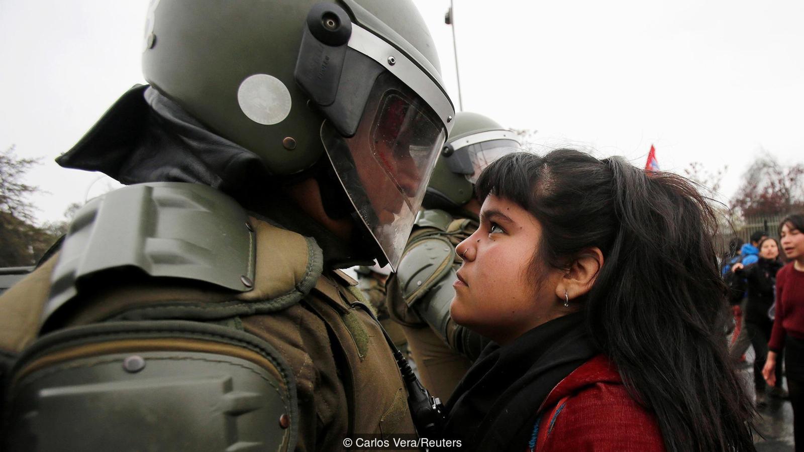 Young woman at the demonstrations marking the 43rd anniversary of the military coup in Chile